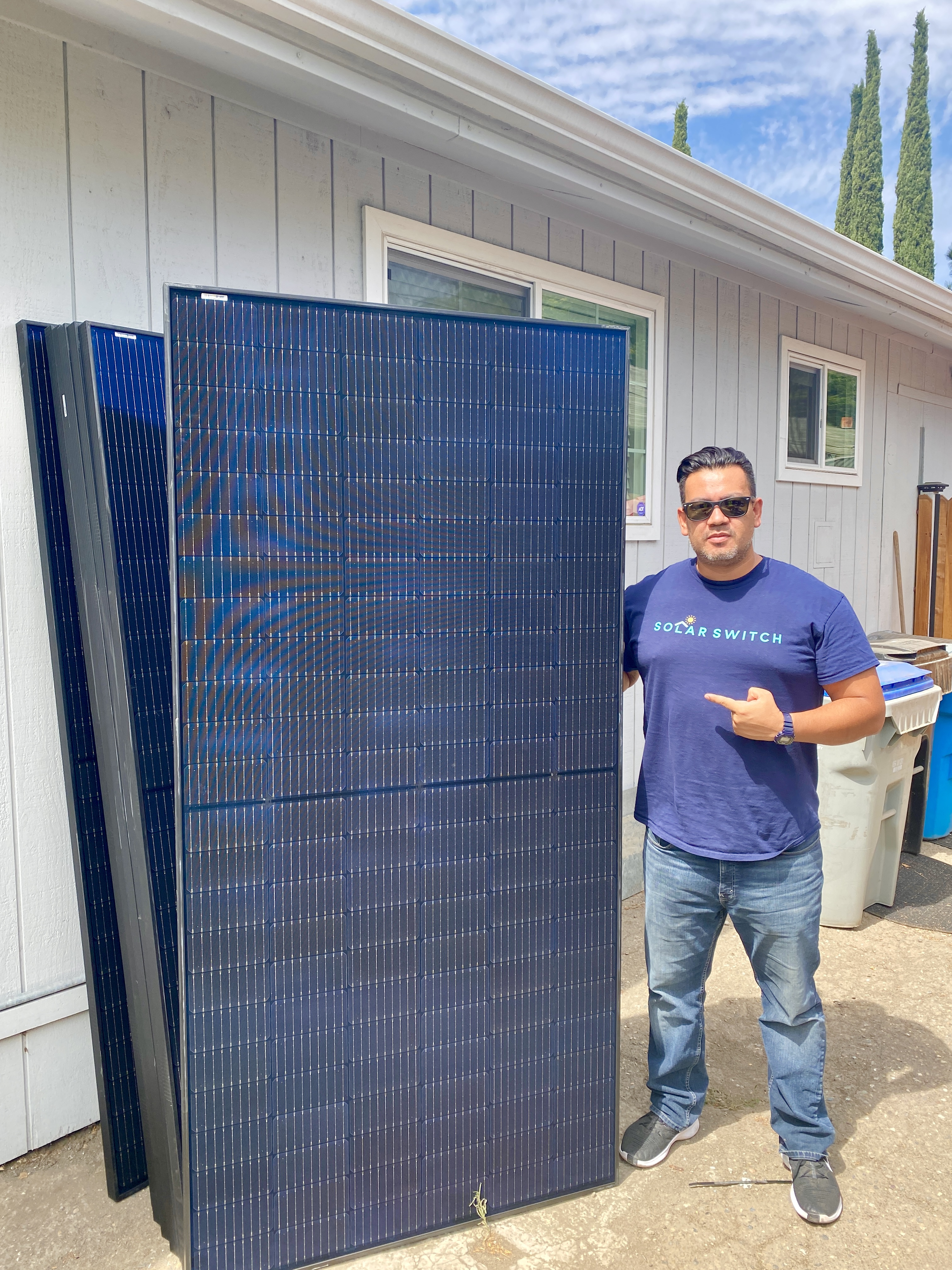 Consultant with solar panel at job site
