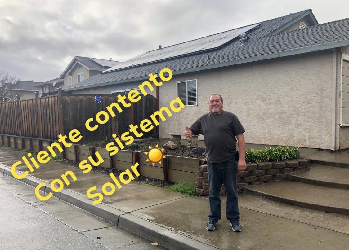 Happy client with solar system installed on home