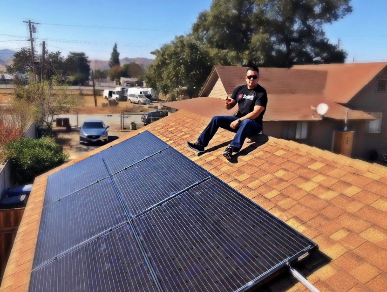 Solar consultant inspecting panel inventory at warehouse